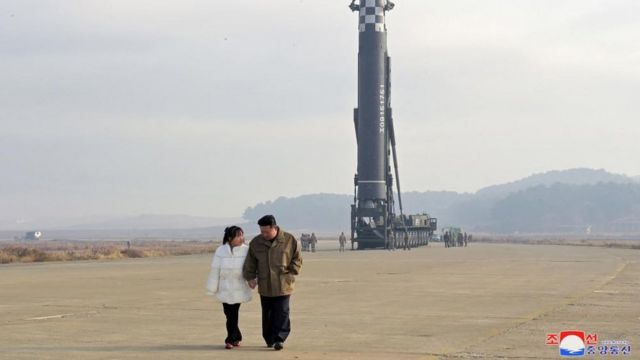 One of the photos released by KCNA on November 19 of Kim Jong-un and his daughter in front of an intercontinental ballistic missile