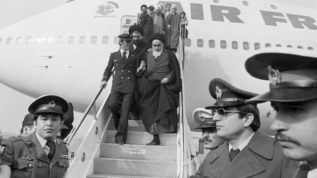 Khomeini gets off the plane