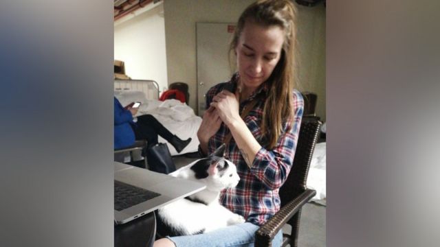 Anastasiya with her cat Freddie in a bomb shelter