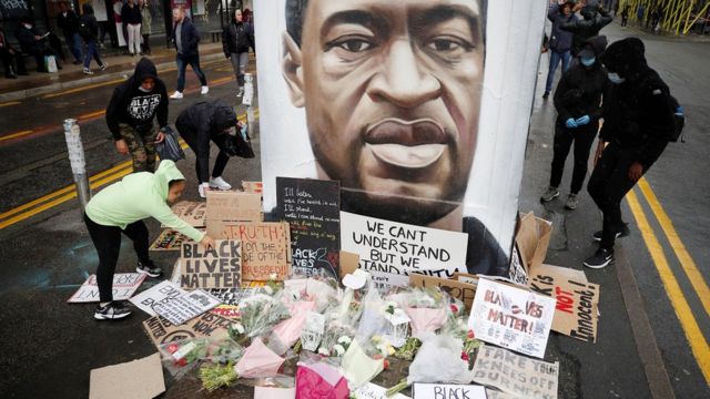 People left tributes at a mural of George Floyd in Manchester