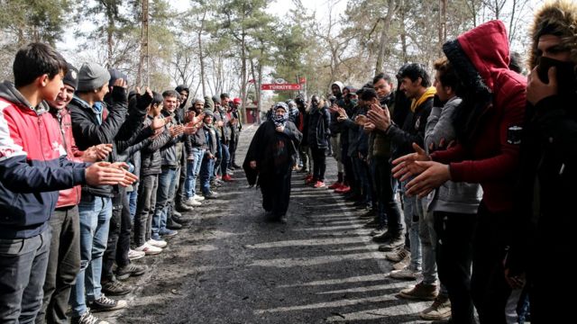 Women Asylum Seekers, waiting at Turkey's Pazarkule border crossing to reach Europe, stage a demonstration at the buffer zone demanding they be permitted to cross during International Women's Day, 8 March 2020
