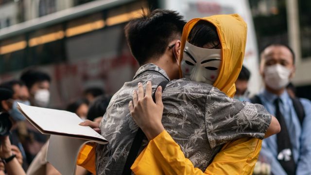 5: Mourners embrace during the one-year anniversary memorial vigil to commemorate Marco Ling-kit Leung at a shopping mall on June 15, 2020 in Hong Kong, China.