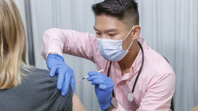 Doctor giving vaccine