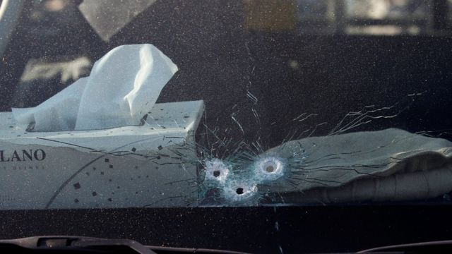 Bullet holes are seen in the window of the vehicle carrying Japanese doctor Tetsu Nakamura after an attack in Jalalabad