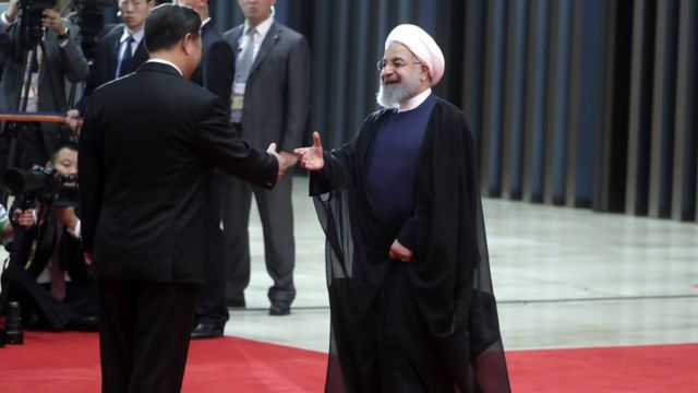 Xi Jinping and Hassan Rouhani.