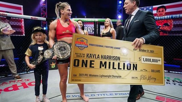 Kayla Harrison receives her m cheque