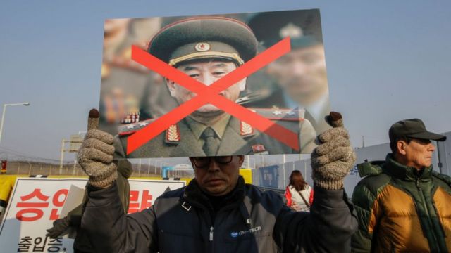 South Korean sunken ship Cheonan victims family members rally against North Korean vice chairman Kim Yong Chol visit near the Unification Protester hold with tear off North Korean Flag at Unification Bridge near Panmunjom in Paju, South Korea, on 25 February 2018