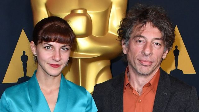 Honeyland directors Tamara Kotevska and Ljubo Stefanov with the Oscar statue in the background
