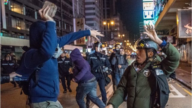 n this photo taken on February 9, 2016, protesters clash with police during demostrations, later dubbed the 'Fishball Revolution', in the Mongkok area of Hong Kong.