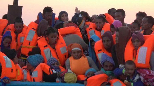 Migrants in life jackets