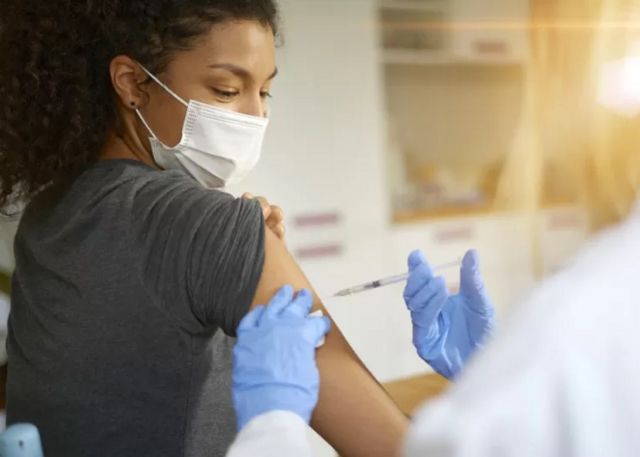 A woman getting vaccinated