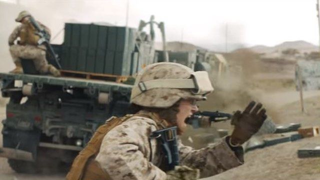A screegrab from the Marine Corps recruiting advert showing a female Marine under fire