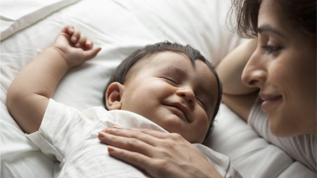 Mother with baby son (12-17 months) sleeping