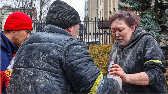 A woman receives help after a Russian attack in Kiev