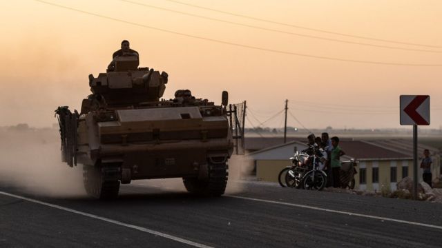 A Turkish tank heads for the border with Syria as Operation Peace Spring begins