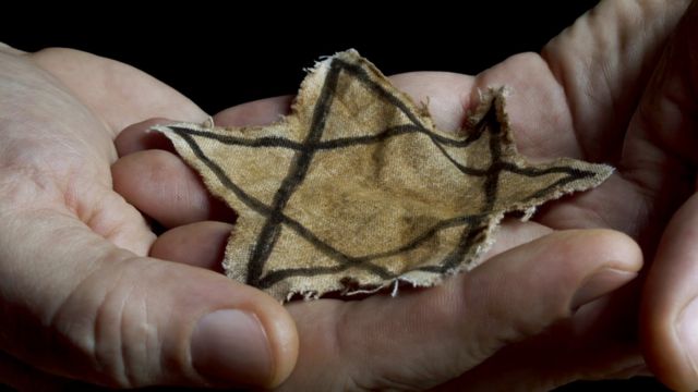 Person holding a Star of David.