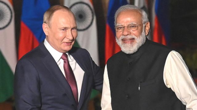 Prime Minister Narendra Modi (R) greets Russian President Vladimir Putin before a meeting at Hyderabad House in New Delhi on December 6, 2021