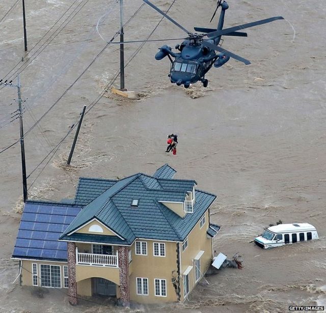 Japanese helicopter rescuing people during a flood