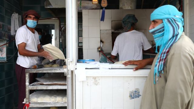 A baker in Dubai makes hot breads before breakfast