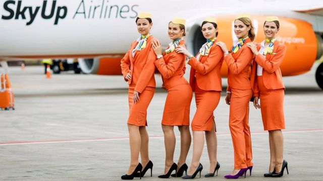 The reason why flight attendants wear high heels