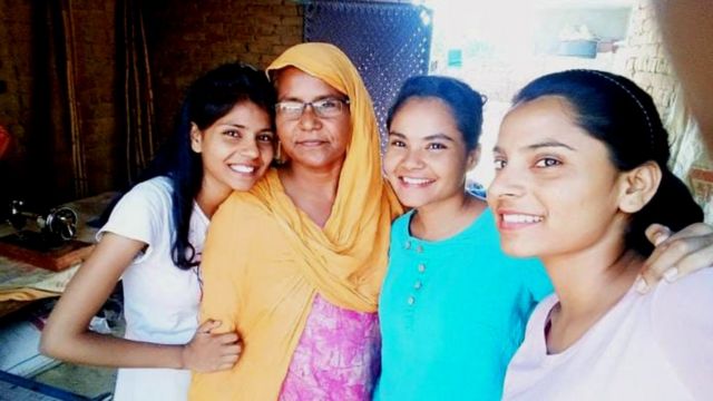 Nodeb with her mother and two sisters