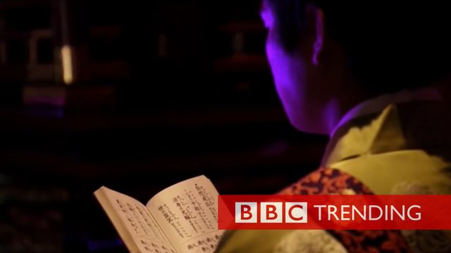 Man performs techno service in Shoonji temple in Japan.