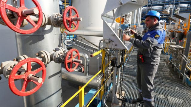 Worker operates the controls of Nord Stream 2