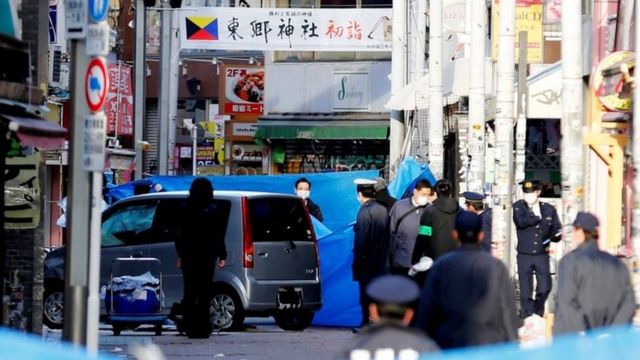 Policemen stand next to a car which ploughed into pedestrians on New Year day in Tokyo, Japan, January 1, 2019.