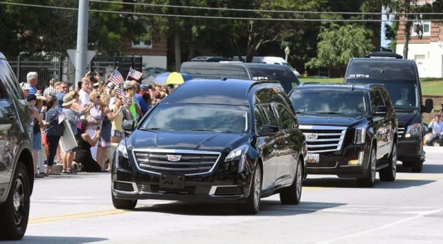 A hearse containing the body of Senator John McCain arrives for his burial