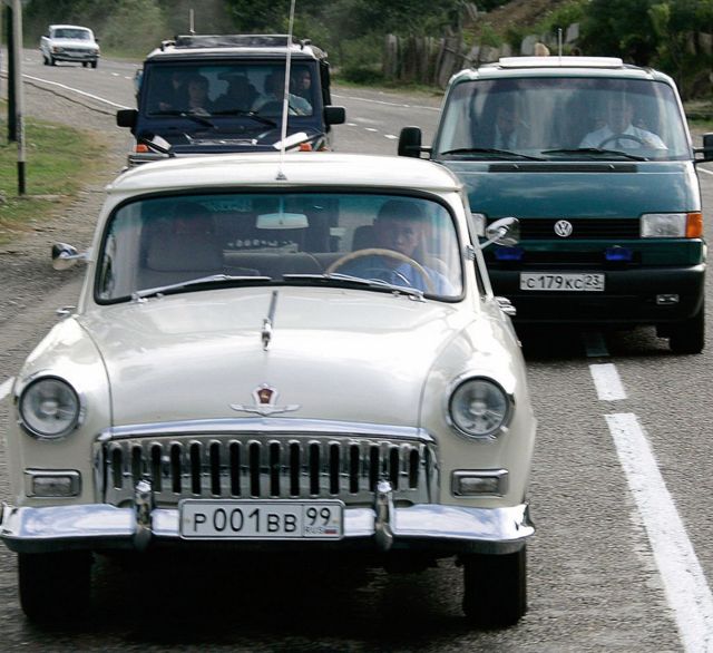 Vladimir Putin in one of his collectible Volga cars in August 2005.