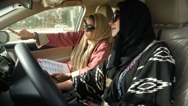 A Saudi woman drives a car