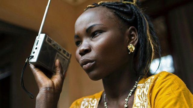 An athlete in South Sudan listening to the radio, March 2016