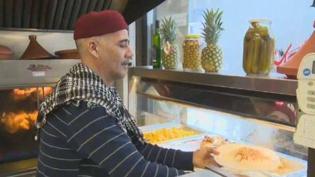 Chef Abdelkader Bejaoui dishes up a hot meal at Marche Ferdous