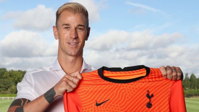 Joe Hart poses with a Tottenham shirt
