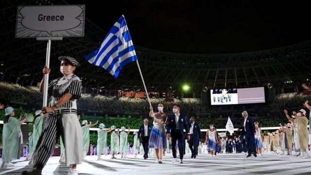 Flag bearers Anna Korakaki and Eleftherios Petrounias of Team Greece lead their team in during the Opening Ceremony of the Tokyo 2020 Olympic Games at Olympic Stadium on July 23, 2021 in Tokyo, Japan.