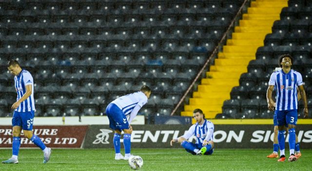 Dejected Kilmarnock players after late defeat to Hearts