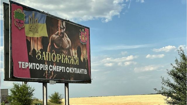 Poster reads: Zaporizhzhia land of death to the occupiers