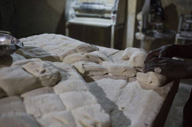 Dough is separated into pieces that will eventually become individual loaves of bread at Buru Niouman Bakery in Bamako, Mali. 5 February 2019.