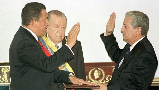 Moment in which the late Hugo Chávez takes office in front of his predecessor, Rafael Caldera.