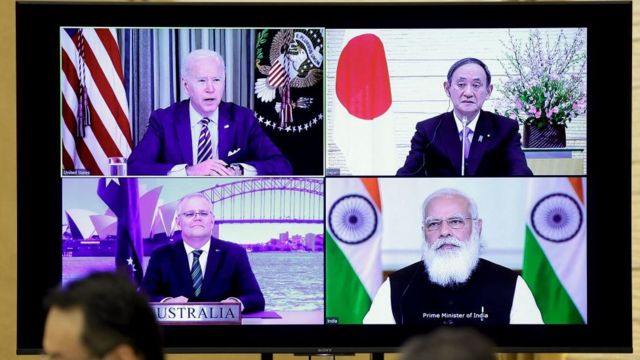 A monitor displaying a virtual meeting of the Quad members - Australia, India, Japan and the United States