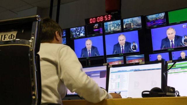 President Vladimir Putin's address to the nation as seen from a TV control room