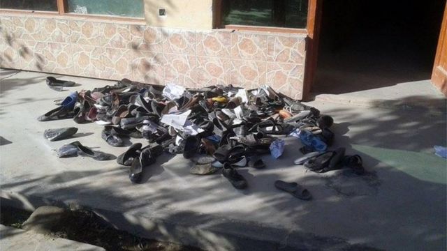 The abandoned shoes of Afghan schoolgirls involved in a deadly stampede are seen outside a school following an earthquake in Takhar Province (October 26, 2015)