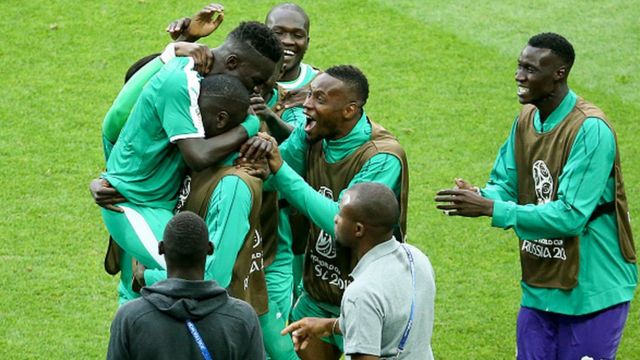 Senegal team celebrate dia win over Poland