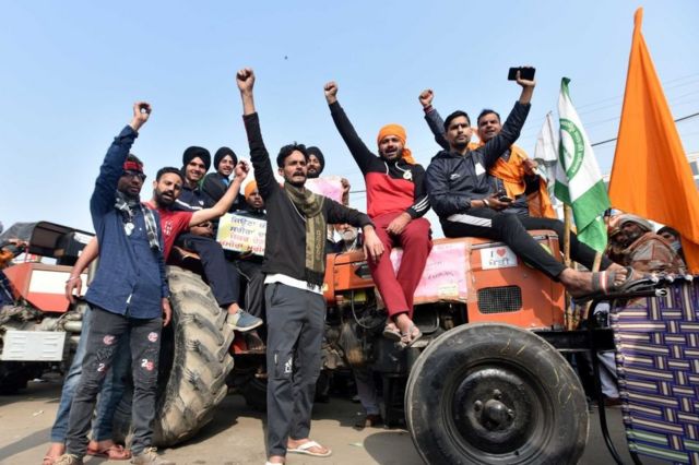 Farmers with his tractor arrive for enter in the capital for Tractor Republic Day parade rally during their farmers' ongoing agitation over the new farm laws, at Singhu border on January 25, 2021 in New Delhi,