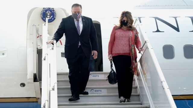 Secretary of State Mike Pompeo and his wife Susan Pompeo disembark from a plane upon arrival at the airport in New Delhi, India, on October 26, 2020