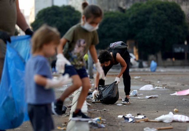 Protesters help clean up in Beirut on Monday morning