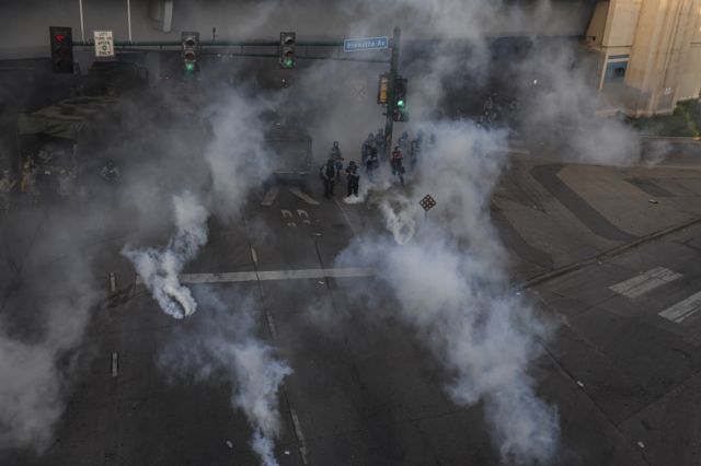 12. Police deploy tear gas during protests resulting from the killing of an unarmed black man, George Floyd, by police.