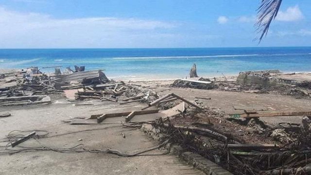 Debris litters the beach in Nuku'alofa, Tonga, after the tsunami - near Atata island where Mr Folau was