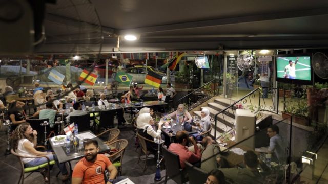 Syrians watching the World Cup match between Mexico and Germany at a cafe in Damascus