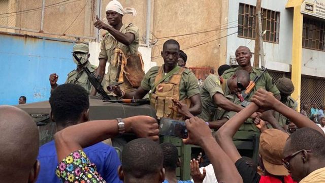 Malian soldiers are celebrated as they arrive at the Independence Square in Bamako, Mali - 18 August 18, 2020.